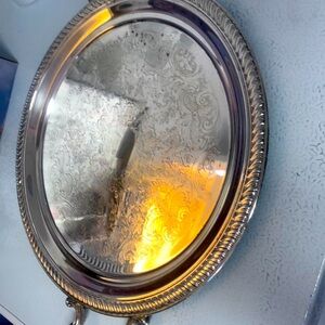 Tray 12 inches diameter 14 inches with handles not sure if silver plated